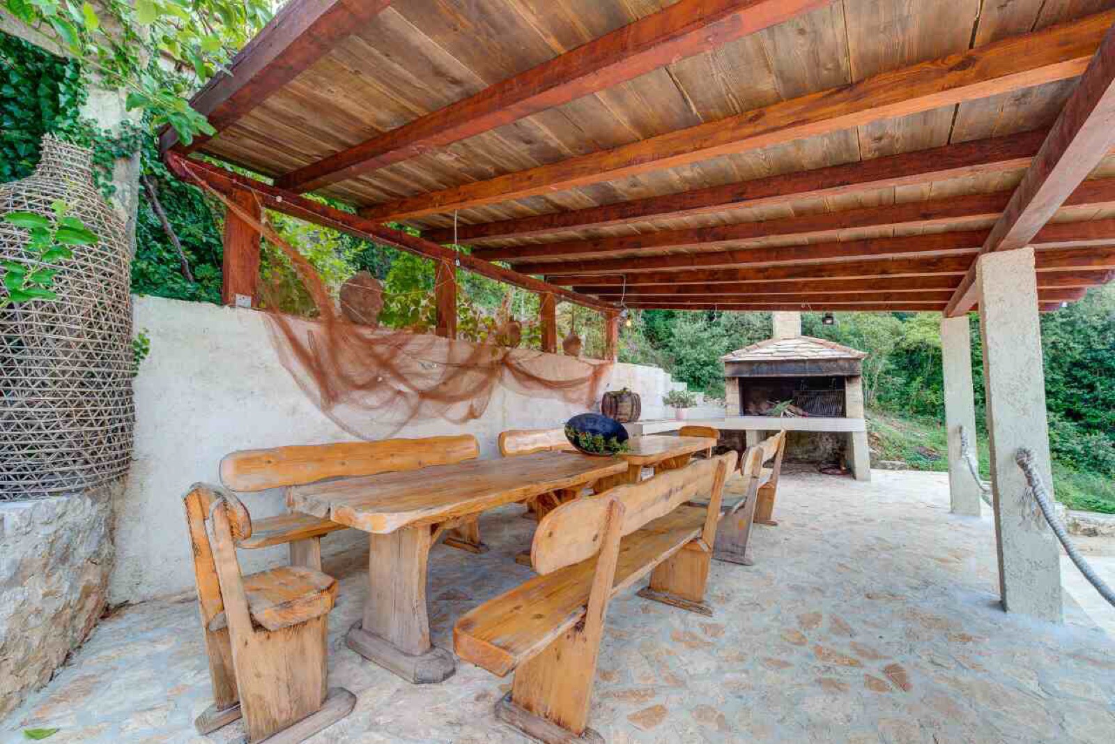 Covered dining pergola and stone BBQ
